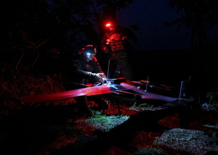Ukrainian servicemen prepare a drone equipped with artificial intelligence elements before flying it over Russian positions near the front line in Donetsk region, Ukraine, on May 18.