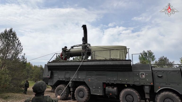 Service members mount a missile on a Russian Iskander-M missile launcher during nuclear forces exercises at an unidentified location in Belarus, in this still image taken from handout footage released on May 21, 2026. Russian Defence Ministry/Handout via REUTERS ATTENTION EDITORS - THIS IMAGE WAS PROVIDED BY A THIRD PARTY. NO RESALES. NO ARCHIVES. MANDATORY CREDIT. WATERMARK FROM SOURCE.