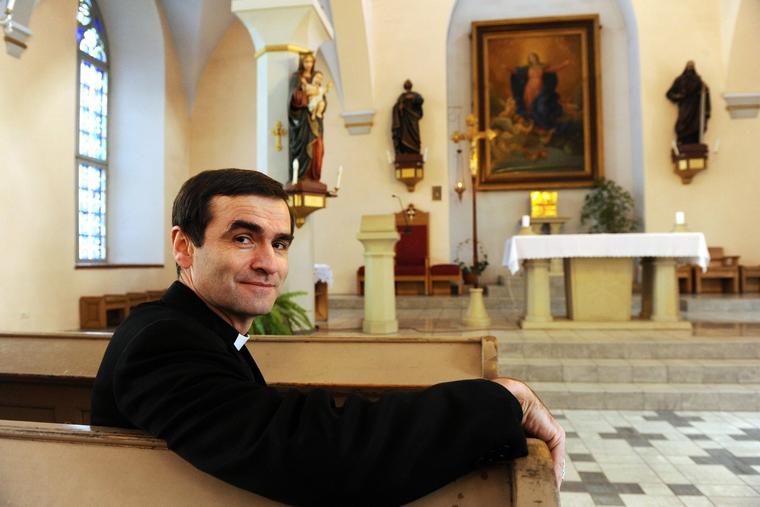 French-born Estonian Bishop Philippe Jourdan sits inside a Catholic church in Tallinn, his diocese, on March 5, 2009.