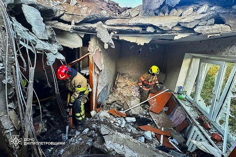 In this photo provided by the Ukrainian Emergency Service, firefighters put out a fire in a building following a Russian air attack in Dnipropetrovsk region, Ukraine, Thursday, May 21, 2026. (Ukrainian Emergency Service via AP)
