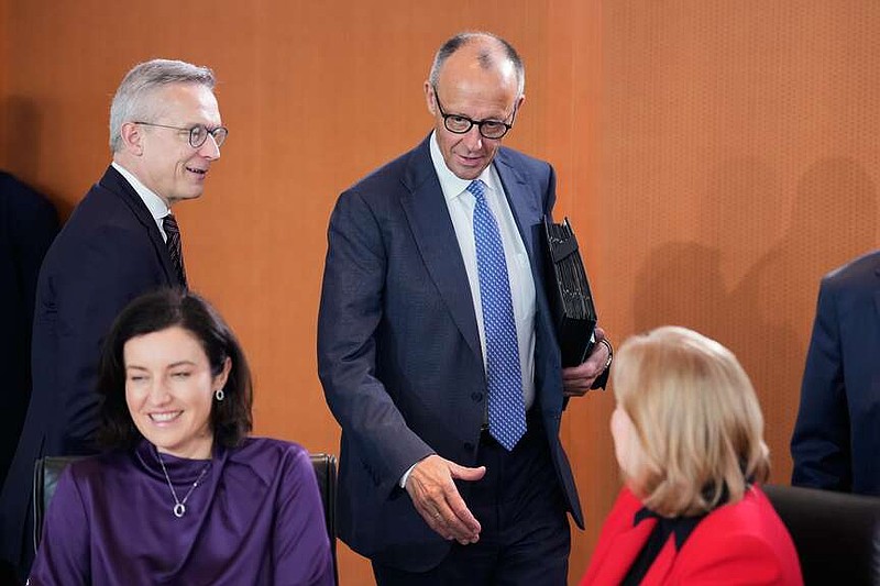 German Chancellor Friedrich Merz, center, attends the cabinet meeting at the chancellery in Berlin, Germany, Wednesday, May 20, 2026. (AP Photo/Ebrahim Noroozi)