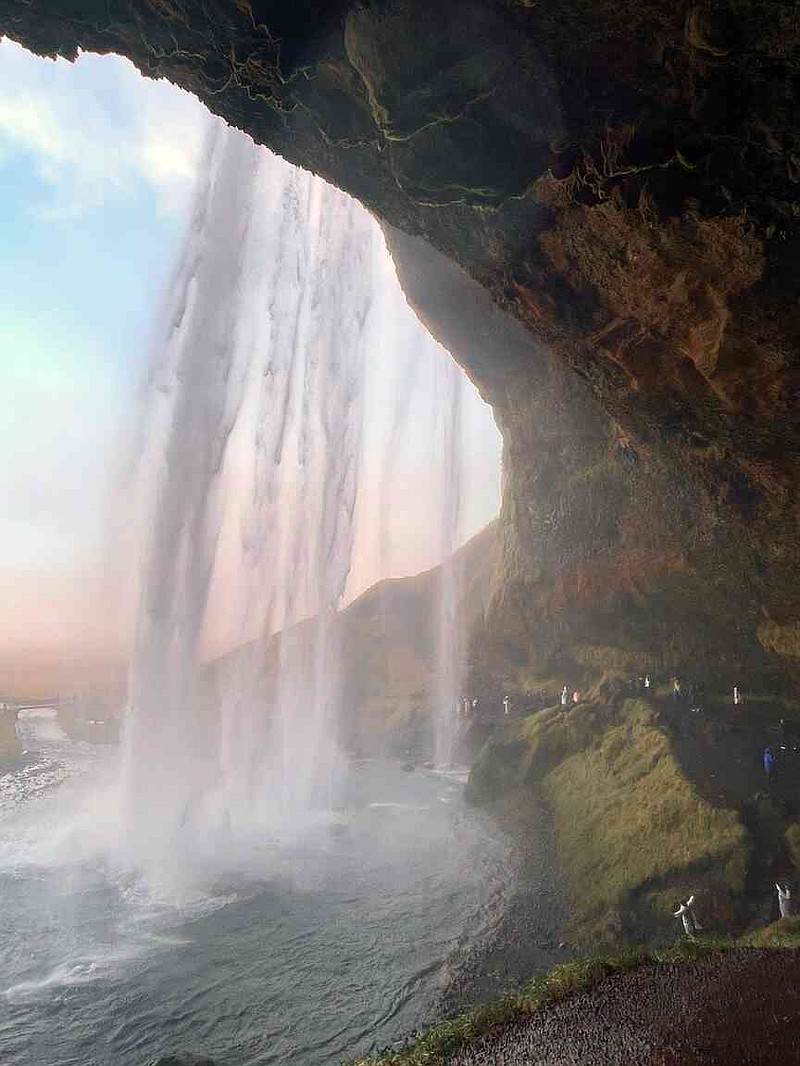 Walk behind a cascade of water at Seljalandsfoss in remote Iceland. (Manuel Meyer/dpa/TNS)