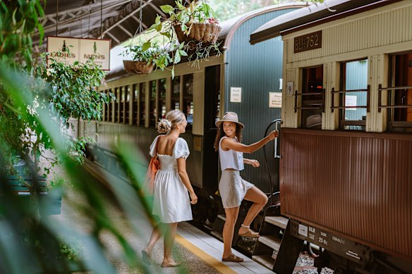 Happy passengers on the Kuranda Scenic Railway (without four small children).