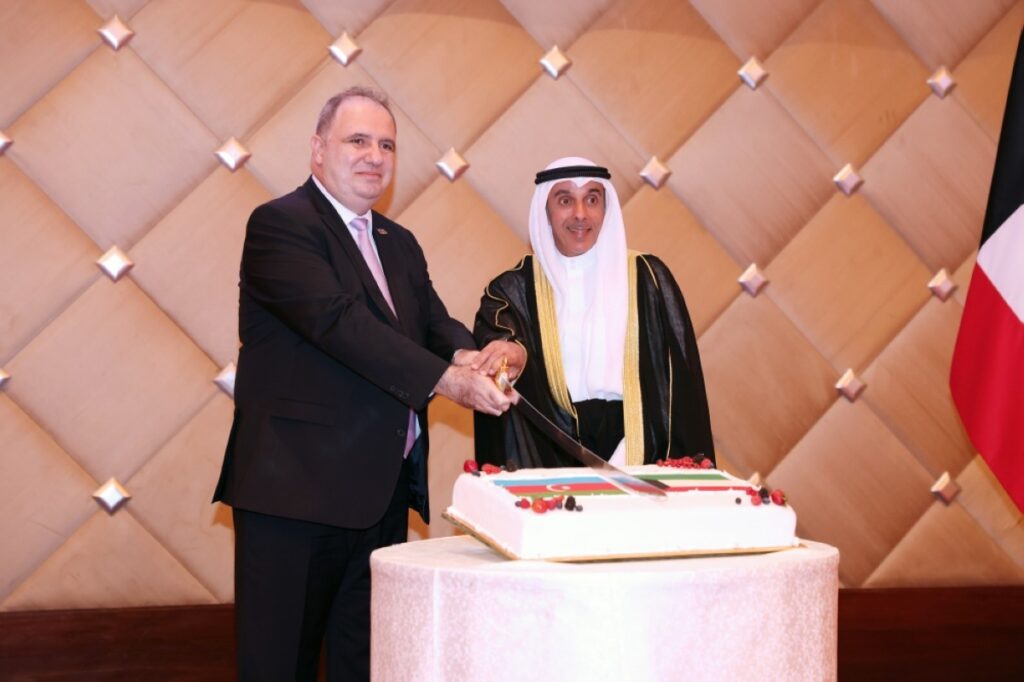 Hamad Suleiman Mashaan Al-Mashaan (right) and Emil Karimov jointly cut the ceremonial cake during the Independence Day celebration. – Photos by Yasser Al-Zayyat