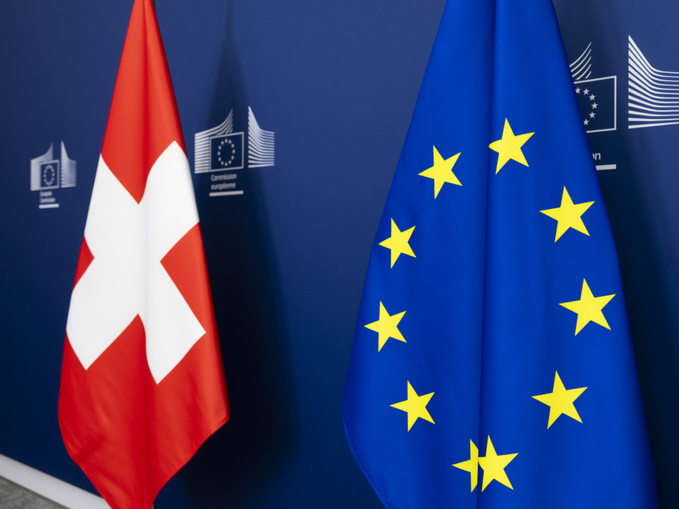 the Swiss flag and the EU flag