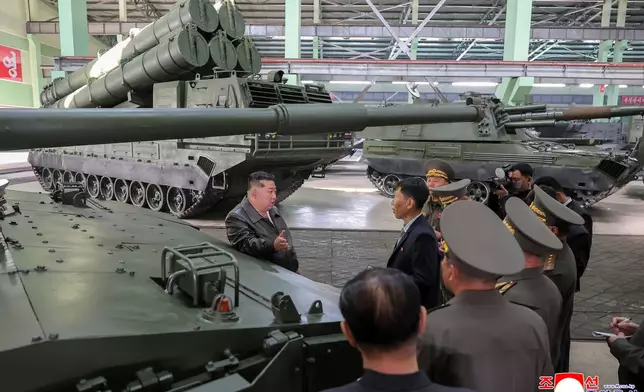 In this photo provided on May 8, 2026, by the North Korean government, its leader Kim Jong Un, center, visits a major munitions factory at an undisclosed location, North Korea Wednesday, May 6, 2026. Independent journalists were not given access to cover the event depicted in this image distributed by the North Korean government. The content of this image is as provided and cannot be independently verified. Korean language watermark on image as provided by source reads: "KCNA" which is the abbreviation for Korean Central News Agency. (Korean Central News Agency/Korea News Service via AP)
