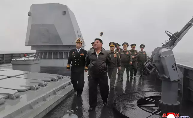 In this photo provided on May 8, 2026, by the North Korean government, its leader Kim Jong Un, center, visits the destroyer Choe Hyon to review its maneuverability off North Korea's west coast, Thursday, May 7, 2026. Independent journalists were not given access to cover the event depicted in this image distributed by the North Korean government. The content of this image is as provided and cannot be independently verified. Korean language watermark on image as provided by source reads: "KCNA" which is the abbreviation for Korean Central News Agency. (Korean Central News Agency/Korea News Service via AP)