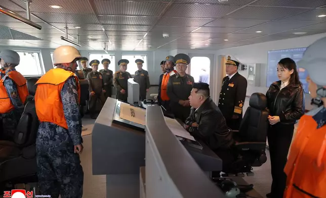 In this photo provided on May 8, 2026, by the North Korean government, its leader Kim Jong Un, center, and his daughter inspect the destroyer Choe Hyon off North Korea's west coast, Thursday, May 7, 2026. Independent journalists were not given access to cover the event depicted in this image distributed by the North Korean government. The content of this image is as provided and cannot be independently verified. Korean language watermark on image as provided by source reads: "KCNA" which is the abbreviation for Korean Central News Agency. (Korean Central News Agency/Korea News Service via AP)