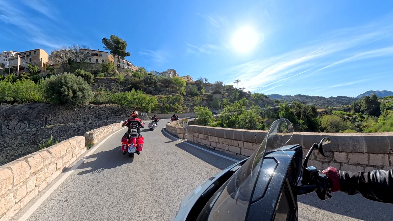 A group of Indian motorcycles on the road. 