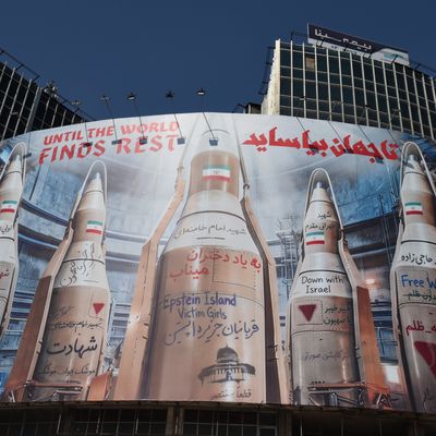 huge art work banner newly posted on the corner of Vali Asr Square depicts Iranian missiles with messages addressing Minab schoolgirls and victims of Epstein Island on March 17, 2026 in Tehran, Iran.