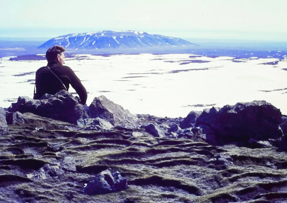 Icelandic Glaciological Society member, Árni Kjartansson, sits overlooking a glacier in Iceland. Image: Archival Materials Courtesy of Andri Snær Magnason.
