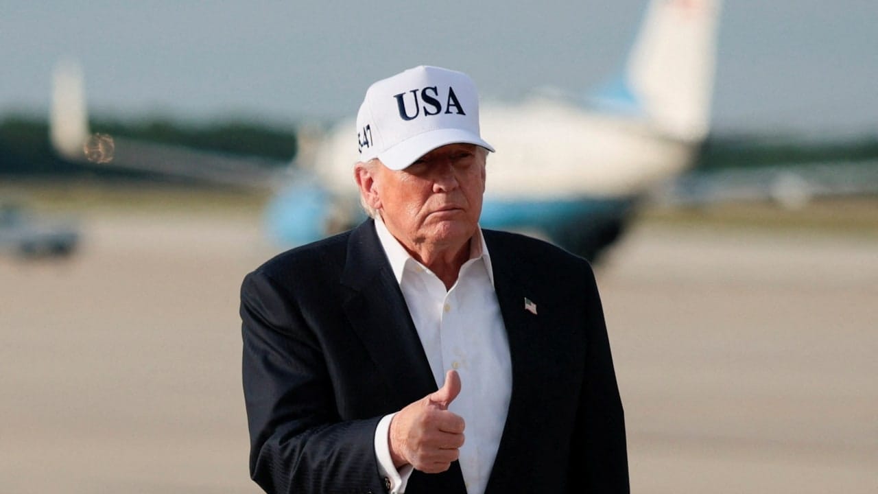 US President Donald Trump gives a thumbs up after disembarking Air Force One following his trip to China at Joint Base Andrews, Maryland, US, May 15, 2026.