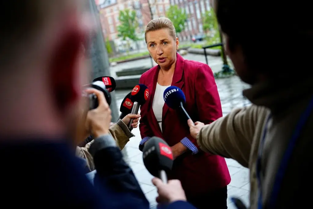 Acting Danish Prime Minister Mette Frederiksen speaks to the media as she arrives for a meeting with appointed royal investigator Troels Lund Poulsen on negotiations to form a government, in Copenhagen, Denmark, May 11, 2026. Ritzau Scanpix/Mads Claus Rasmussen via REUTERS