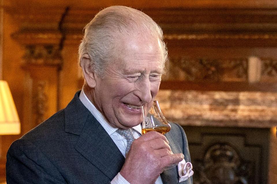 Charles raises a dram while on a visit to Edinburgh (PA Wire)