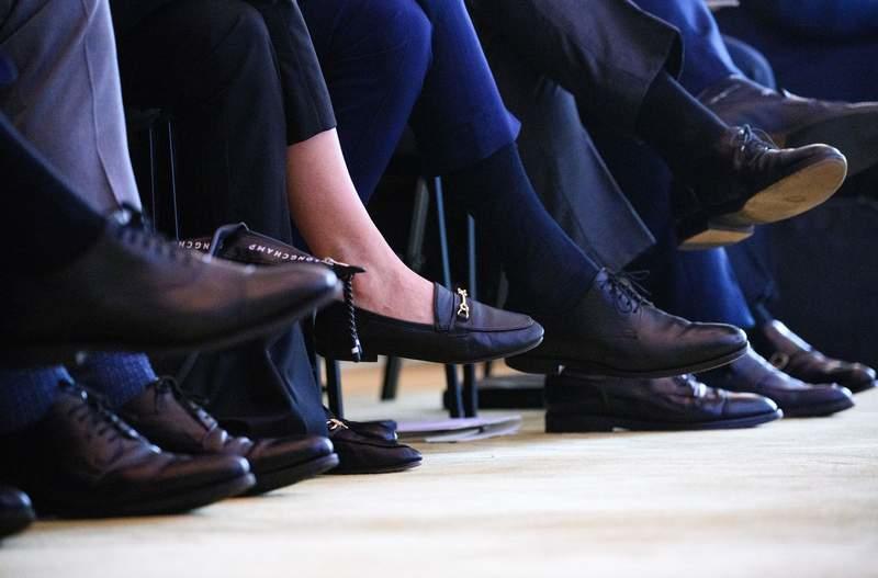 FILE PHOTO - A woman sits among numerous men at the Family Business Day 2024 at the Hotel Adlon. (zu dpa: «Women's board share at Germany's largest listed firms dips again») Bernd von Jutrczenka/dpa