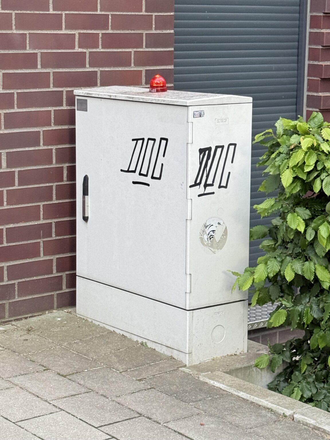 Why is a glowing red warning light on top of this box?
