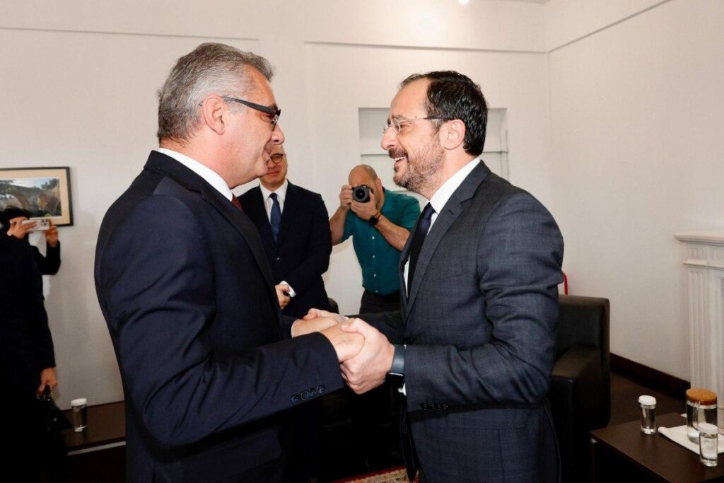 Turkish Cypriot leader Tufan Erhürman greets the President of Cyprus Nikos Christodoulides. (Photo: Archive of the Press and Information Office)
