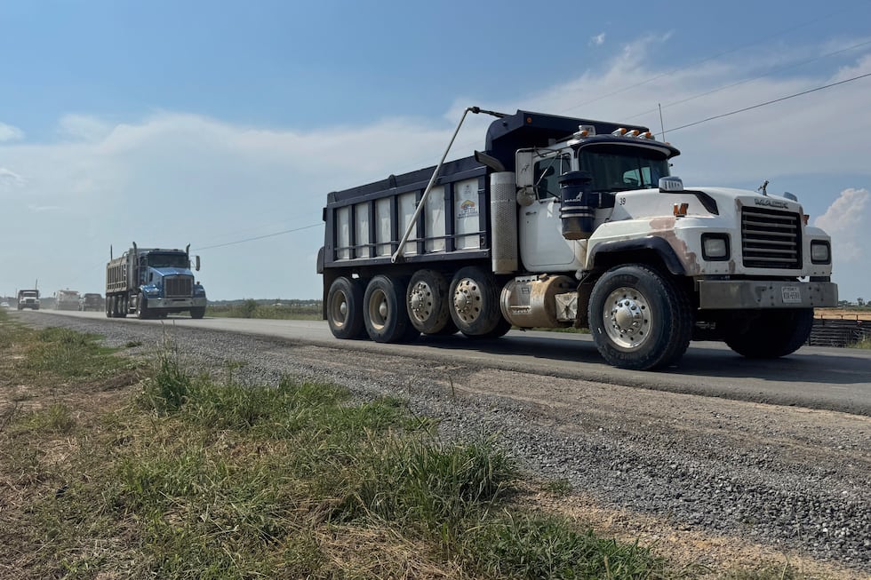 Trucks pass by the site of Meta's Richland Parish Data Center in Holly Ridge, La., Monday,...