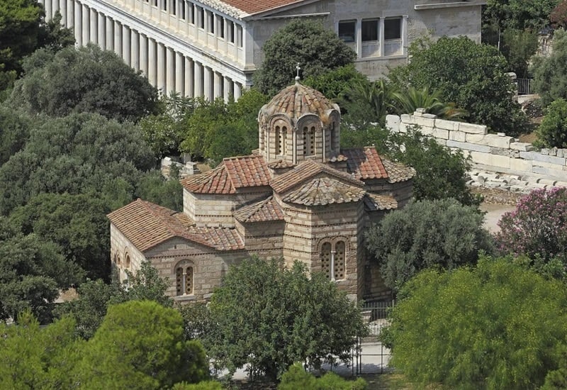 The Holy Apostles Church in Athens surrounded by trees. How has the religious composition of Greece changed?