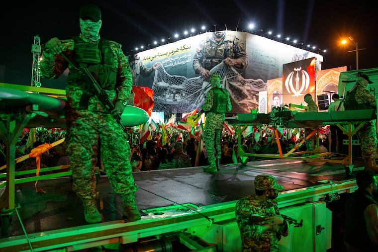 Evolving warfare connects the conflicts in Ukraine and Iran Members of Iran’s Islamic Revolutionary Guard Corps stand near a drone display at a government-organized march in Tehran, April 29, 2026.