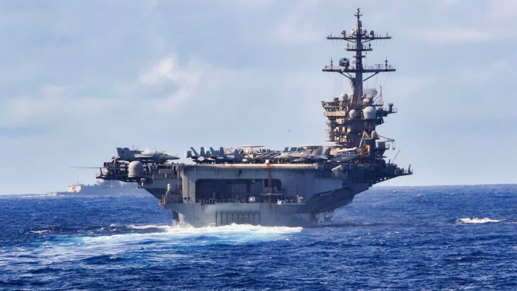 France’s Charles de Gaulle Aircraft Carrier vs. the Nimitz-Class: Which Nuclear Supercarrier Rules the Waves? Navy Aircraft Carrier in the Ocean Sailing.