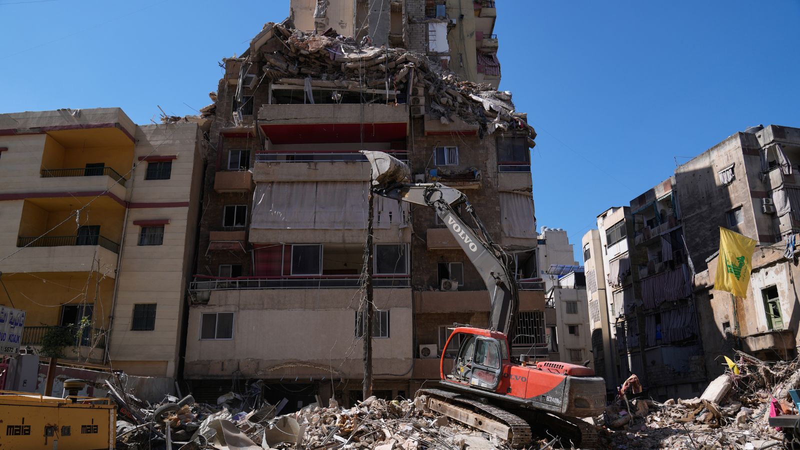 Iran-US-Israel War News Live: An excavator removes the rubble of a destroyed building that was hit in an Israeli airstrike in Dahiyeh, Beirut's southern suburbs, Lebanon, Thursday, May 7, 2026. (AP Photo)