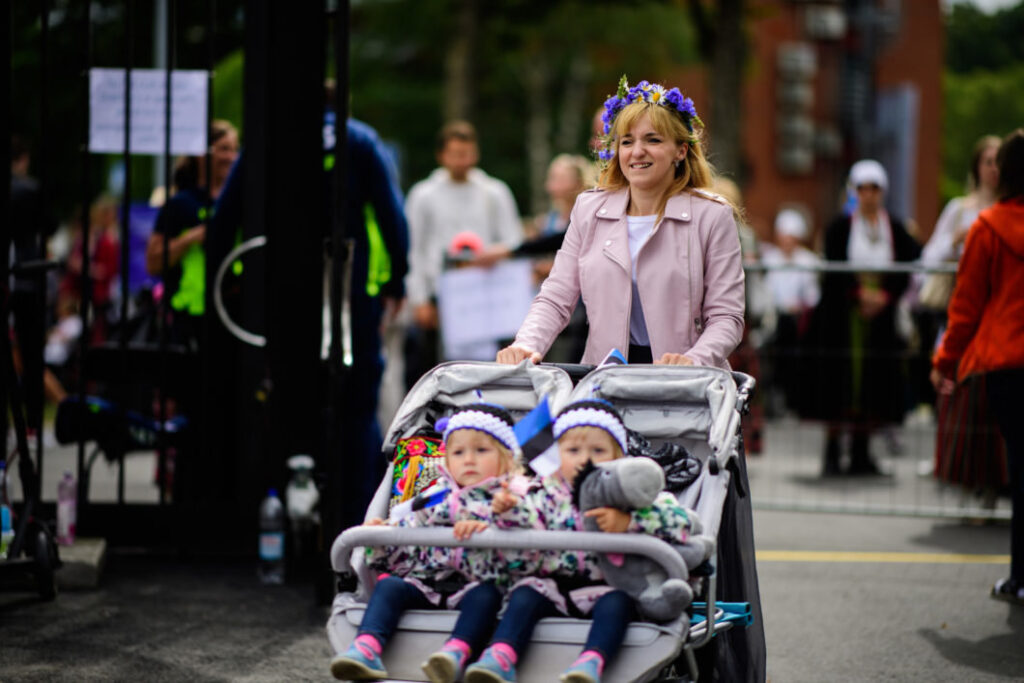 A woman with two children at the Estonian Song Celebration in 2019. Photo by Sven Zacek.