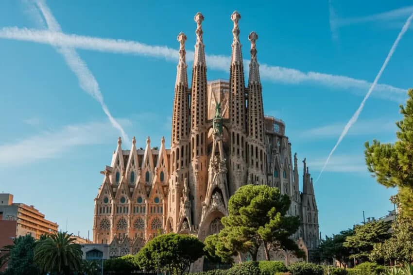 Iconic sagrada familia in barcelona, spain, with clear blue sky.