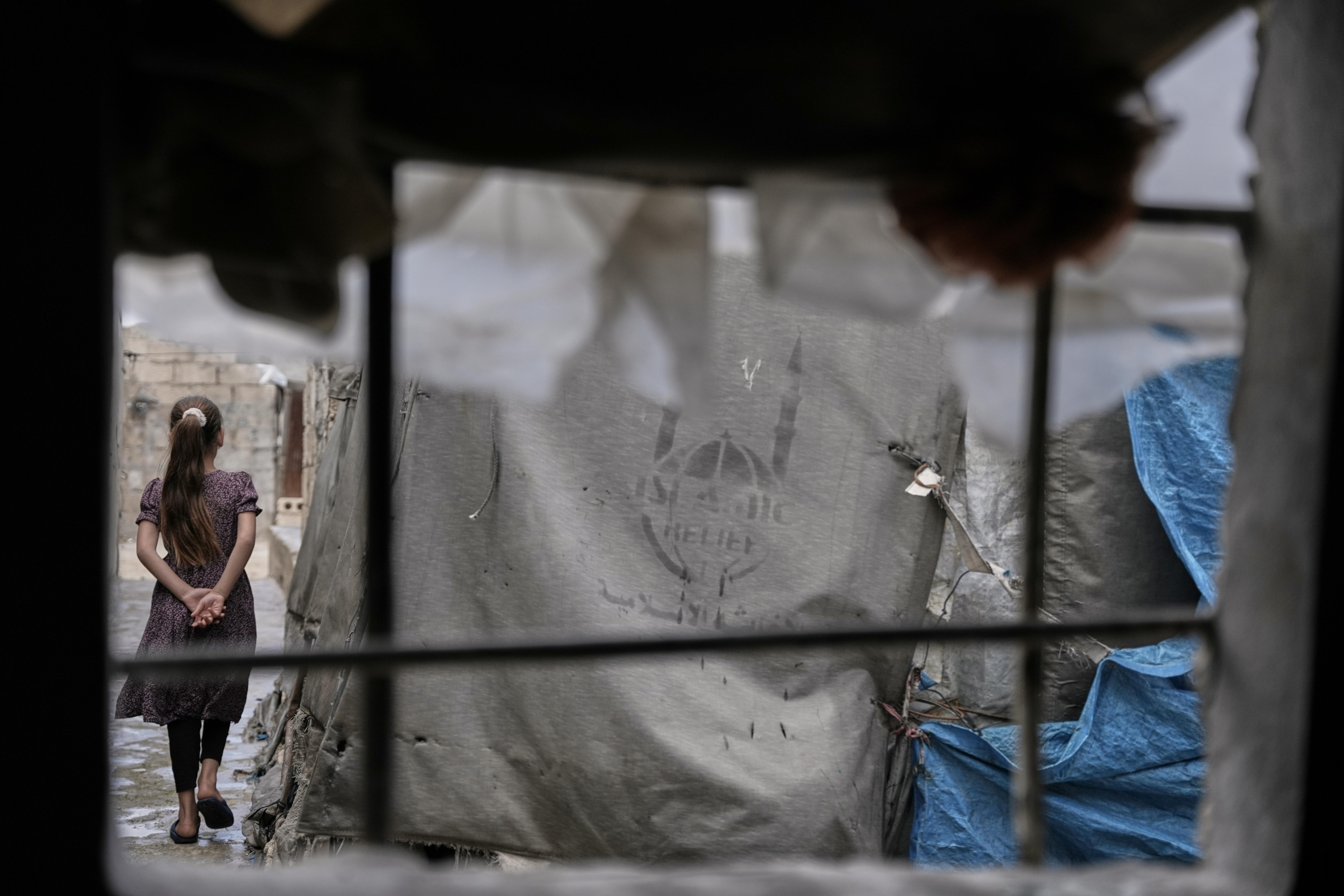 A girl walks through al-Karama camp.