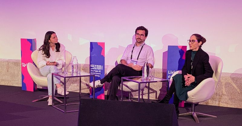 How Portugal’s tiny market could be its secret for scaling startups — TFN Three people sit on stage during a panel discussion