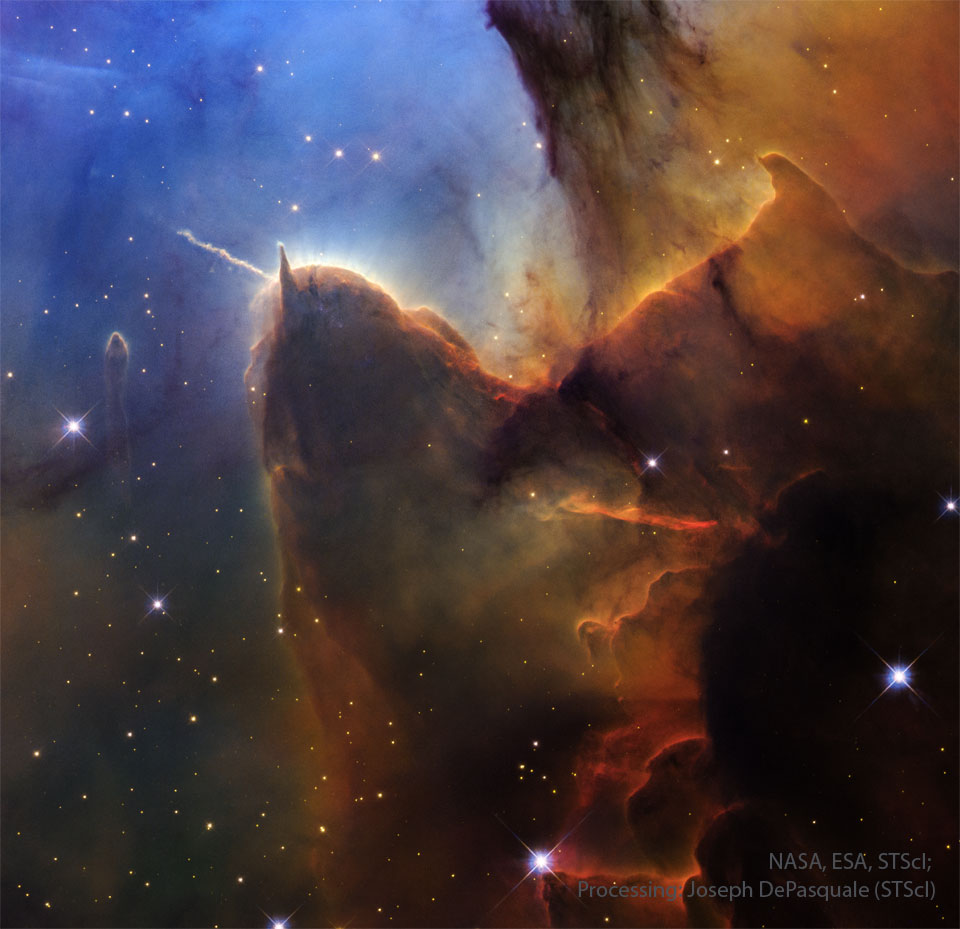 APOD: 2026 May 3 – Trifid Pillars and Jets A field of stars on the left is mirred by a wall of
opaque brown dust on the right. Jutting out from the wall is
a long pillar with a rounded end that has a prominent light-
colored jet emanating toward the upper left. The stellar
background toward the upper left is dark blue.
Please see the explanation for more detailed information.