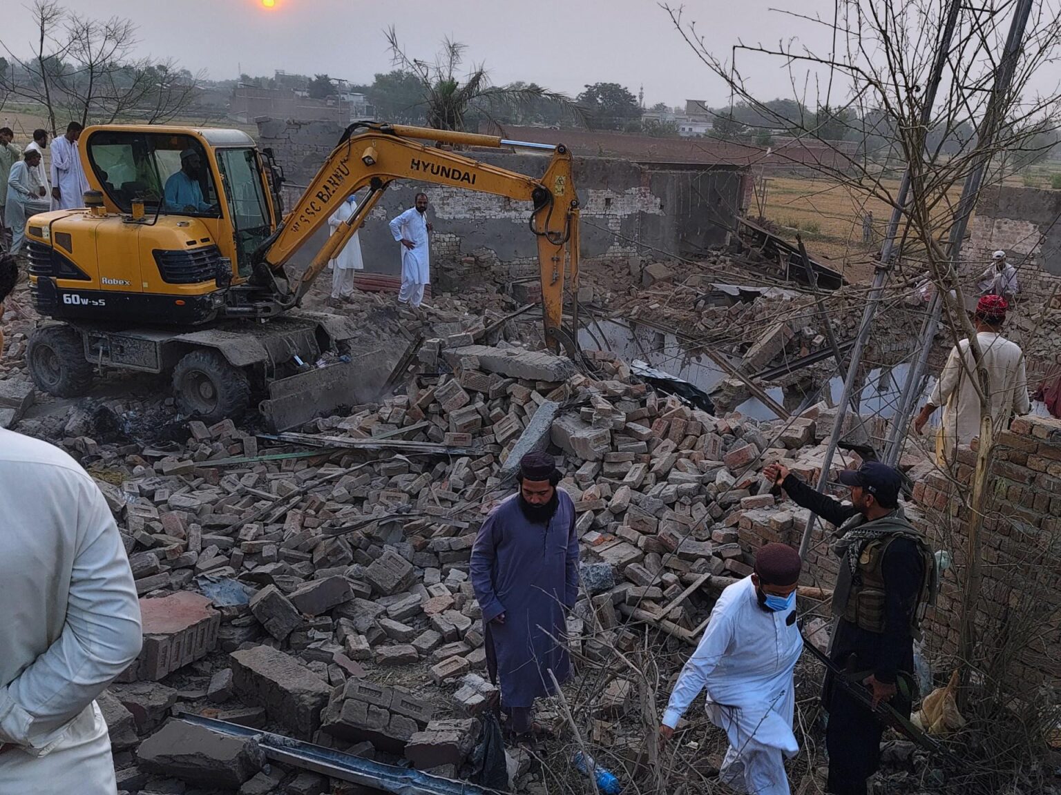 Car bomb attack and ambush in northwest Pakistan kill at least 21 police