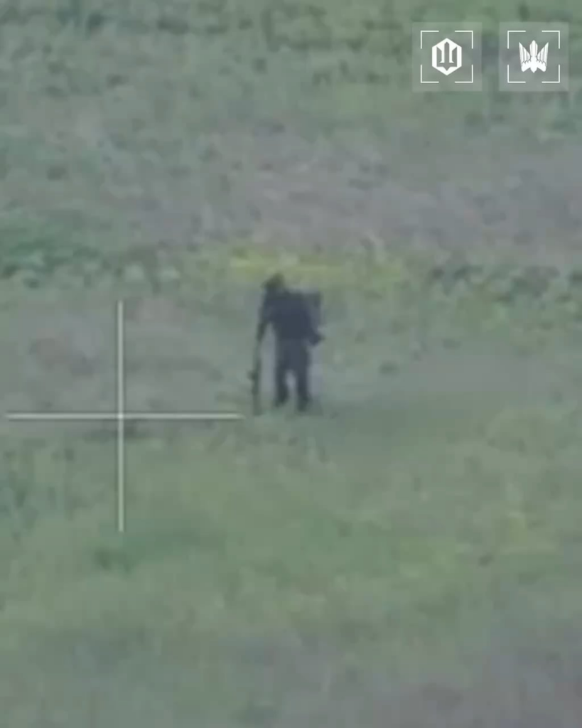 FPV drone hits Russian soldier spotted standing within open field. Ukraine's 414th Strike UAS Brigade, published 5/25/2026.