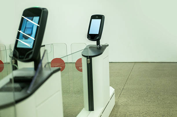 Automated border control gates with biometric scanners in an airport terminal