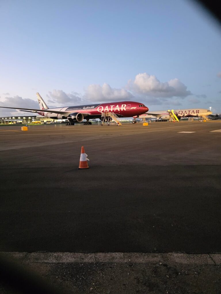 Someone did the picture for Emirates A380, here is Qatar 777 from the DHL carpark,