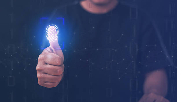 Person using a glowing fingerprint scanner for biometric identity verification