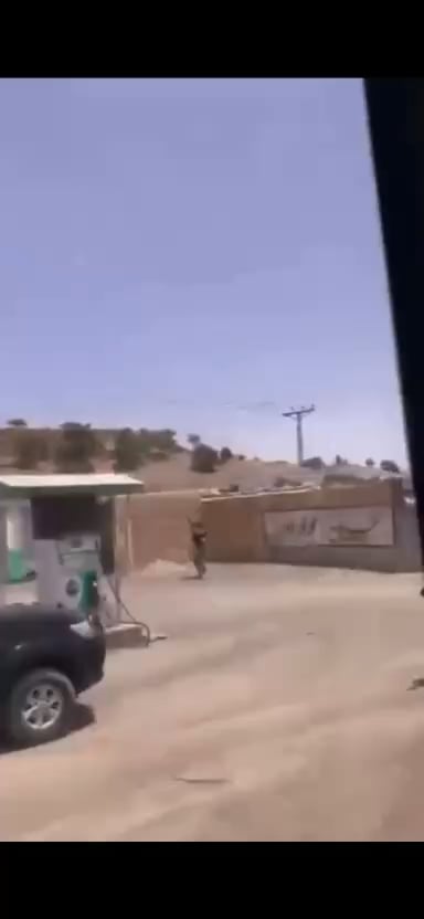 Pakistani soldiers shooting at Taliban Quadcopter while School Bus drives away, Afghan border.