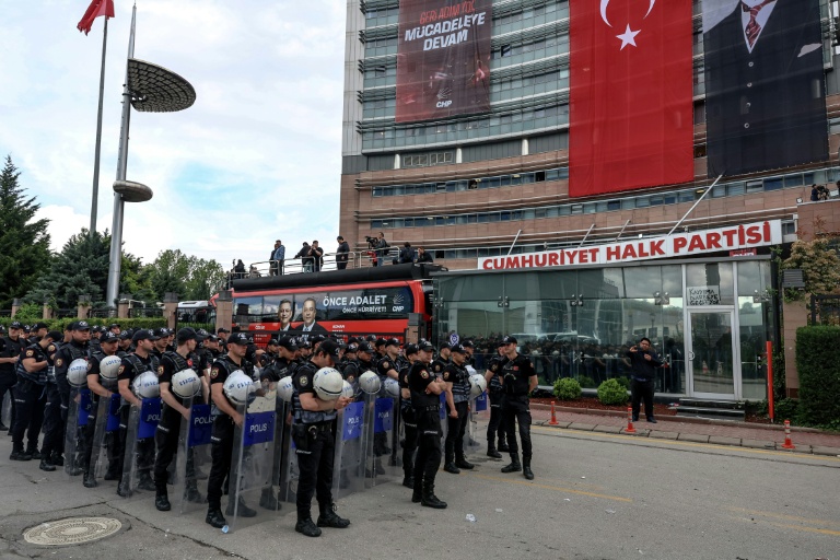 Turkish riot police standing ready outside the opposition CHP party headquarters in Ankara