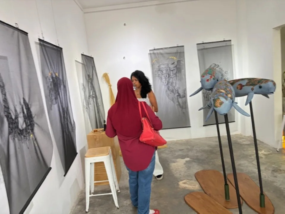 Hanging by a thread by Christine Das on the wall, the Irrawaddy dolphins puppets (middle) and Helmeted hornbills puppets (right) by Bright Ong.