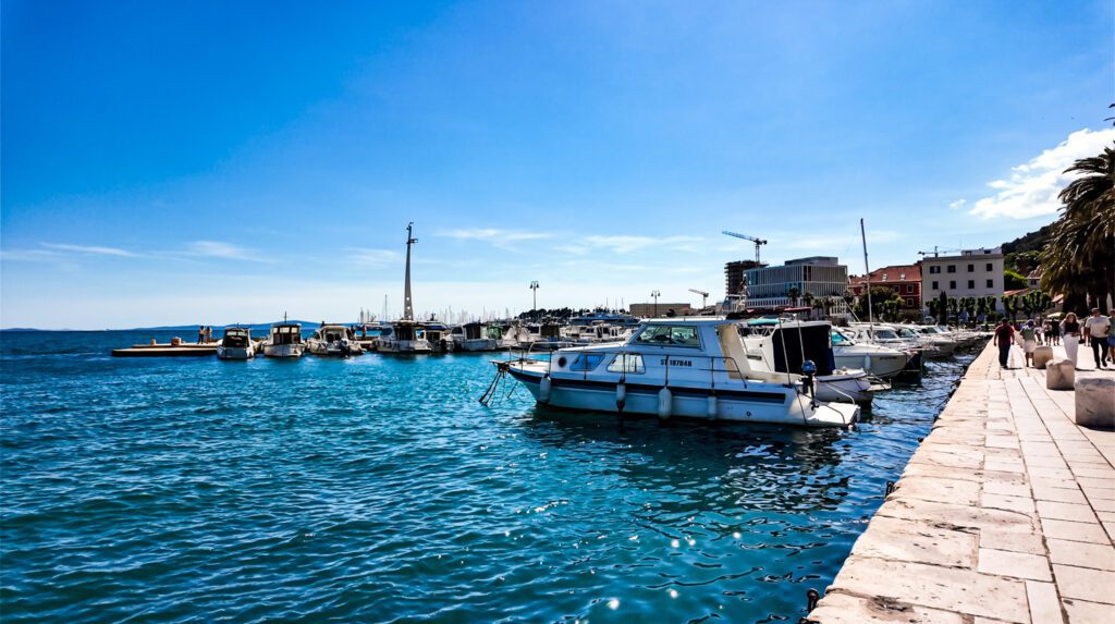 split Croatia Riviera view with boats and people walking