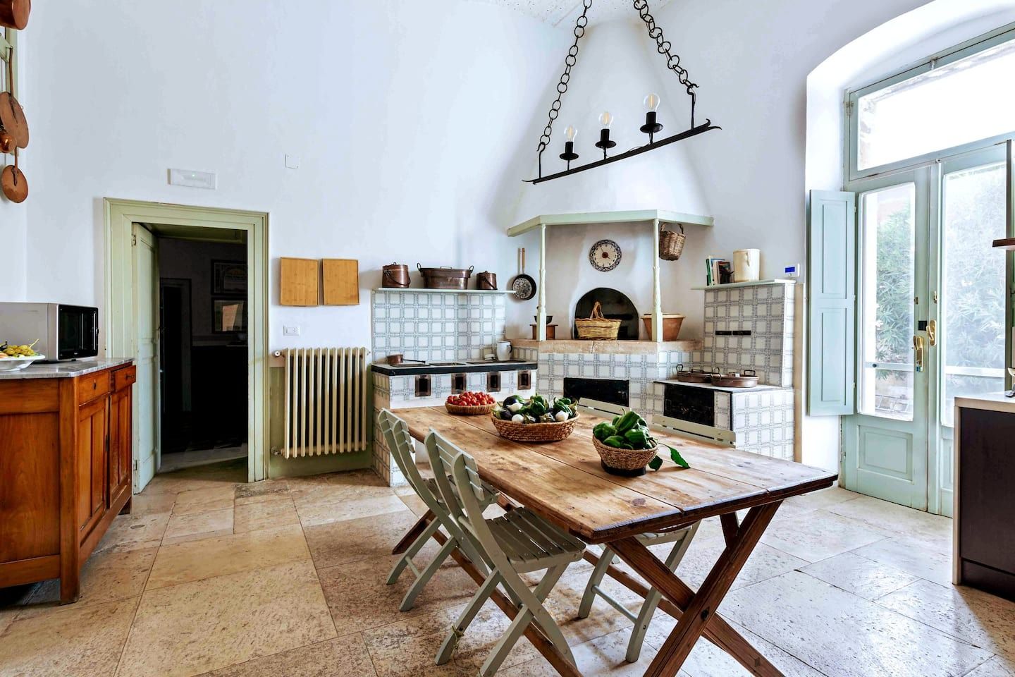 Image may contain Indoors Interior Design Furniture Table Architecture Building Dining Room Dining Table and Room