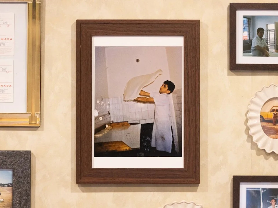  A photo of Shaqir Duraj hangs on the wall in his European Bakery and Deli.
