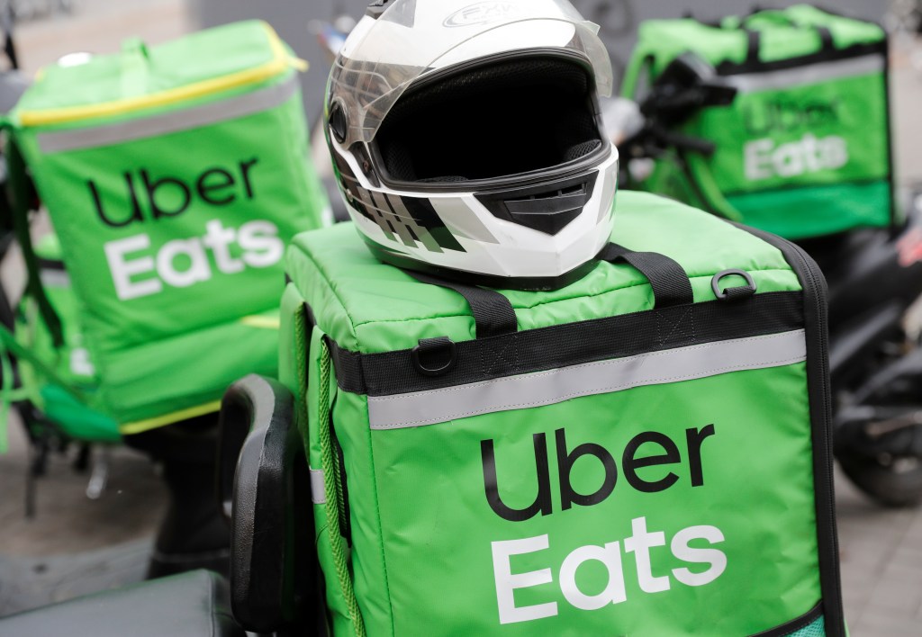 Uber Eats delivery bags and a helmet on a street in central Kiev.