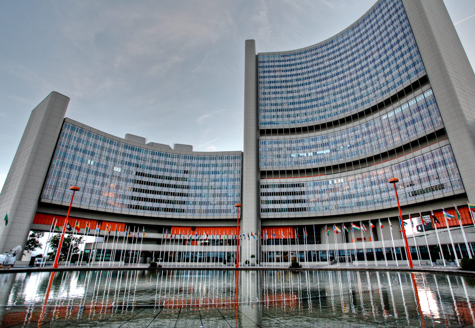 Austria Sees Iran’s Nuclear Weapons Programme Vienna International Centre, headquarters of the IAEA, with curved glass towers and UN member state flags, Vienna, Austria