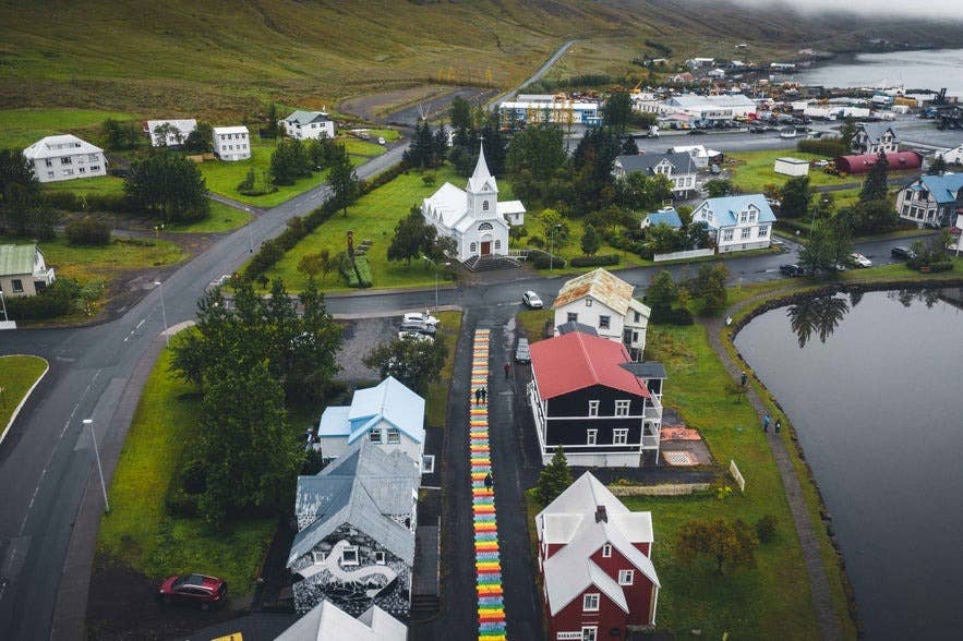 Seydisfjordur Rainbow Street and Church on a misty day, showing the colorful town in Iceland in April. Seydisfjordur Rainbow Street and Church on a misty day, showing the colorful town in Iceland in April.