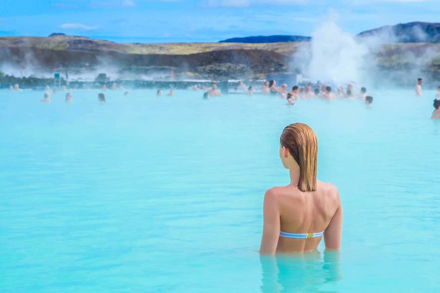 Traveler relaxing in the Blue Lagoon’s milky blue water, a classic geothermal experience in Iceland in April. Traveler relaxing in the Blue Lagoon’s milky blue water, a classic geothermal experience in Iceland in April.