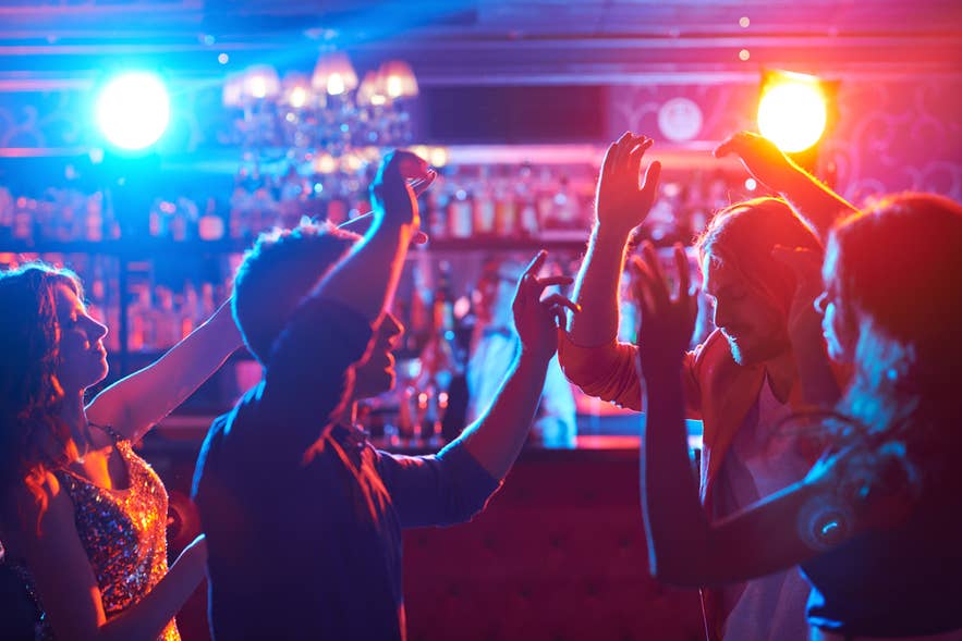 Crowds enjoying Reykjavik’s lively nightlife on Laugavegur Street, with shops, bars, and festive lights after dark. Crowds enjoying Reykjavik’s lively nightlife on Laugavegur Street, with shops, bars, and festive lights after dark.
