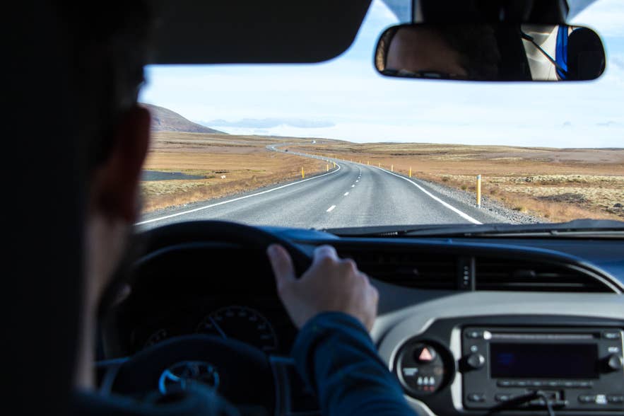 The inside of a car as a couple goes on a road trip through Iceland. The inside of a car as a couple goes on a road trip through Iceland.
