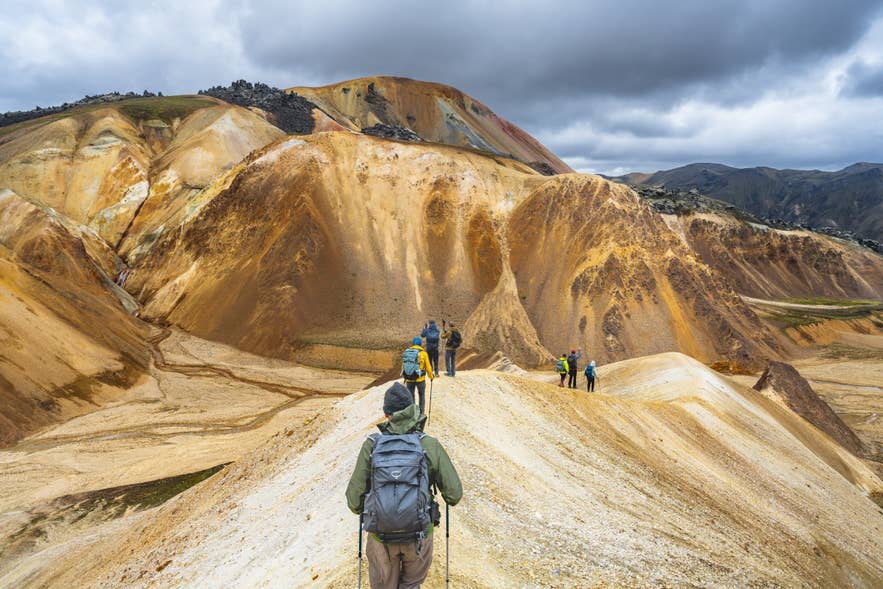 A group hikes the Laugavegur Trail in the Highlands in Iceland. A group hikes the Laugavegur Trail in the Highlands in Iceland.