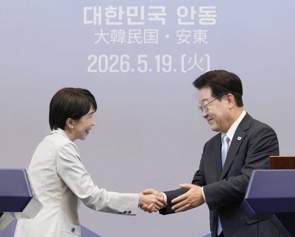 apanese Prime Minister Sanae Takaichi (L) and South Korean President Lee Jae Myung shake hands after a press event following their talks in Andong, South Korea